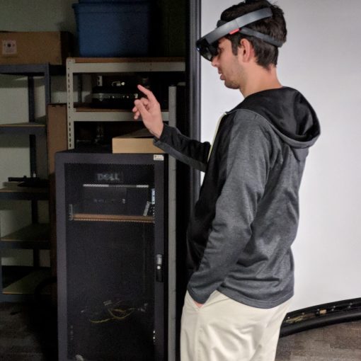 A man wearing a virtual reality headset in a room.