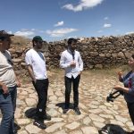 Ayşegül Kidik, a Ph.D. student, from Abdullah Gül University's Architecture Department instructs how to use DATCH at the Cappadocia Gate of the Kerkenes archaeological site in Central Turkey