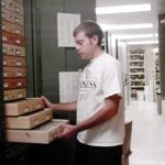 Student opening drawers