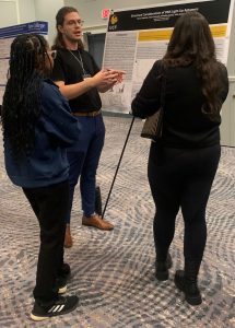 Harun explaining his work at his poster