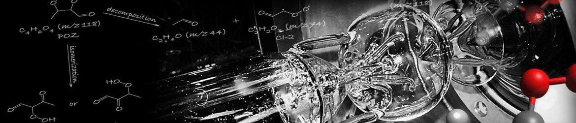 Glass apparatus with flowing liquid and molecular structures, decorated with chemical reaction diagrams and 3D molecular models in the foreground.