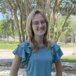 Esther Richards in blue shirt.