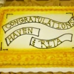 Yellow rectangular cake with "congratulations haven & rita" written on it, decorated with white and yellow borders.