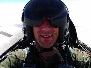 Brian Gerwe in an F-16 jet.