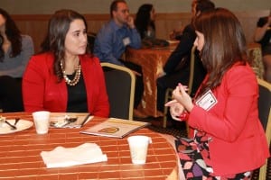 Nicholson student Vanessa Rodriguez talks with mentor Paula Machado, '12. reporter for InfoMas.