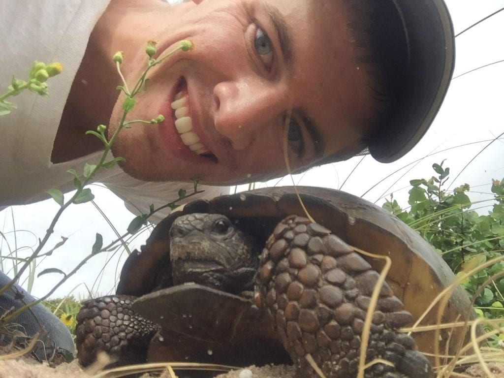 UCF biology student Rhett Rautsaw with a gopher tortoise. 