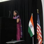 Dr. Swati Vigay Kulkarni delivering her address behind a podium