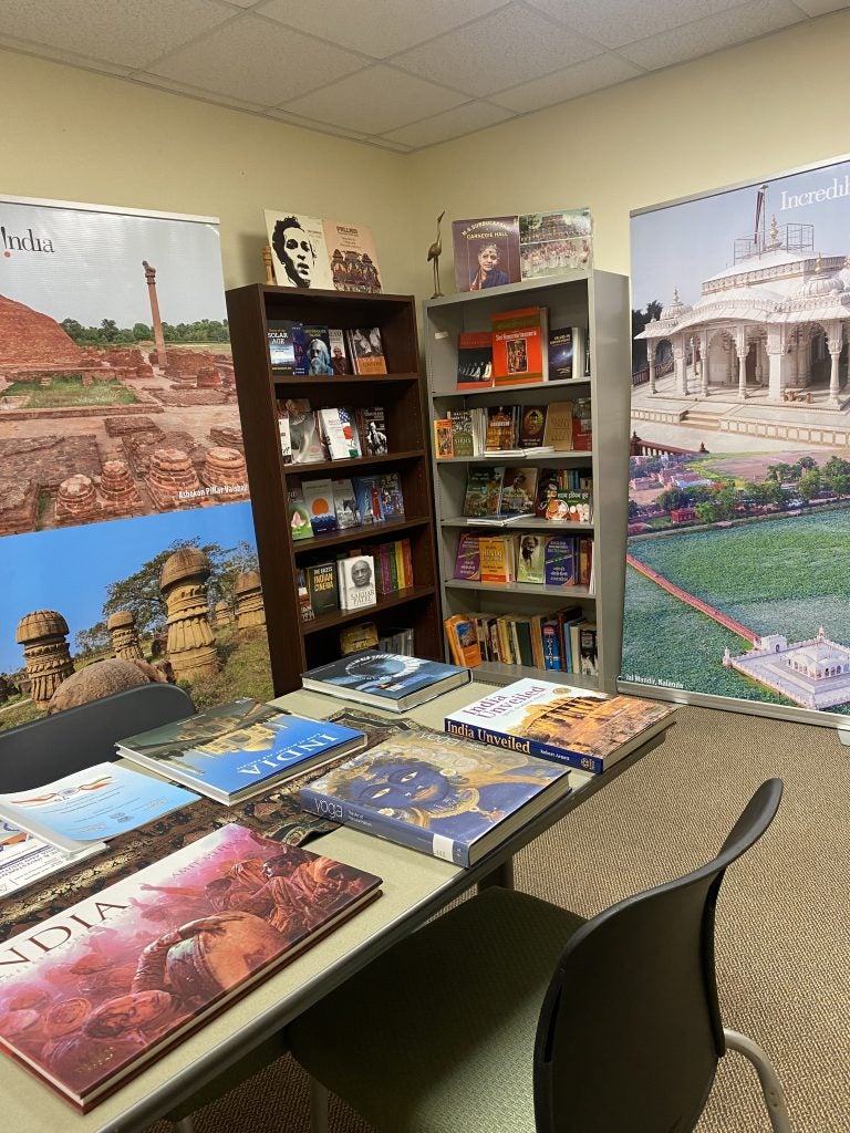 The India Corner at the India Center with books on bookshelves and a table