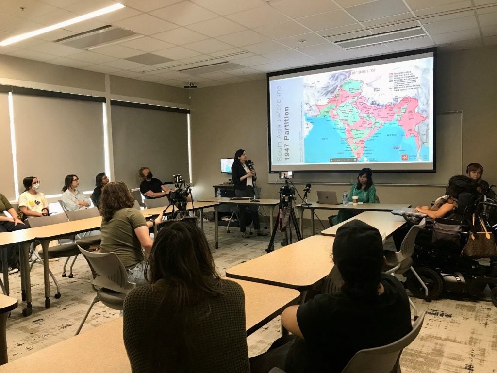 Guneeta Sing Bhalla, Ph.D. presenting at the India Center's Partition event.