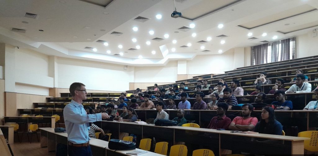 Barry Griffiths, Ph.D. delivering lecture in front of students 