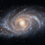 A spiral galaxy with bright central core and arms filled with stars, dust, and gas, set against a backdrop of deep space.