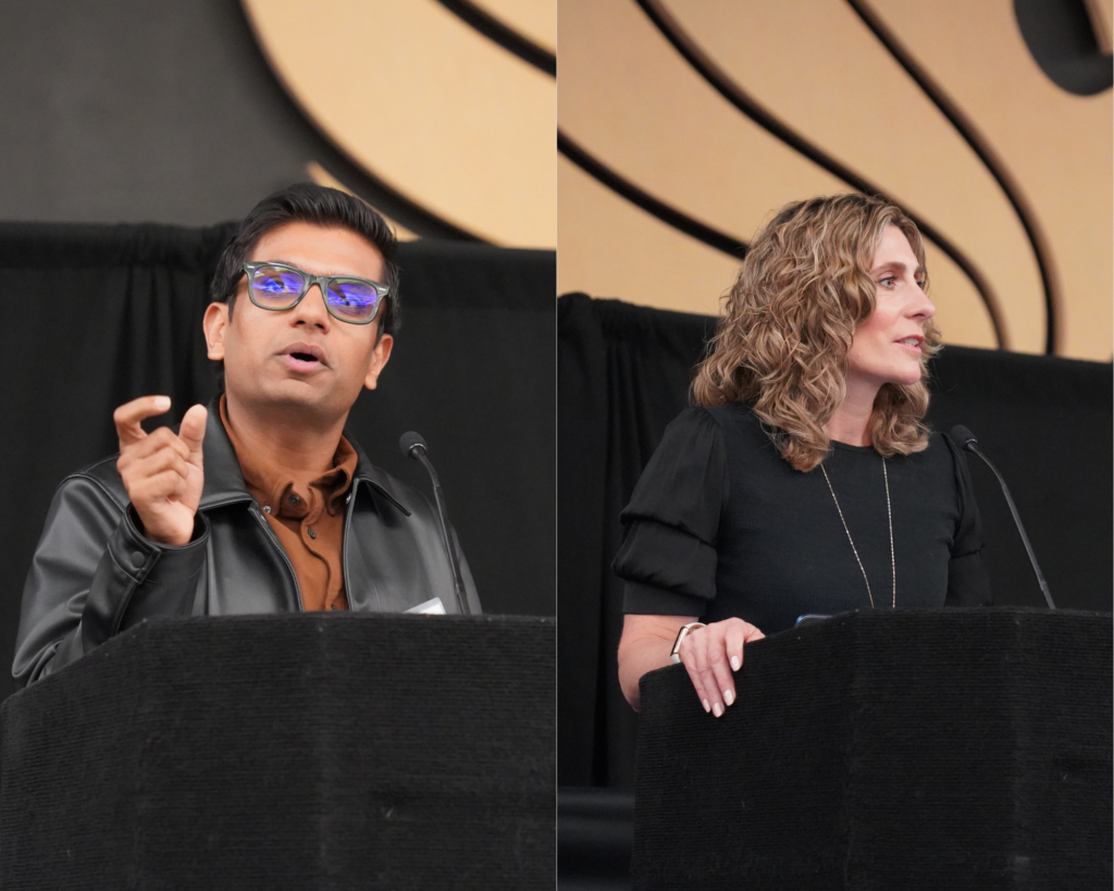 Two people speak at separate podiums against a black and beige background, one man on the left gesturing with his hand, and one woman on the right speaking.