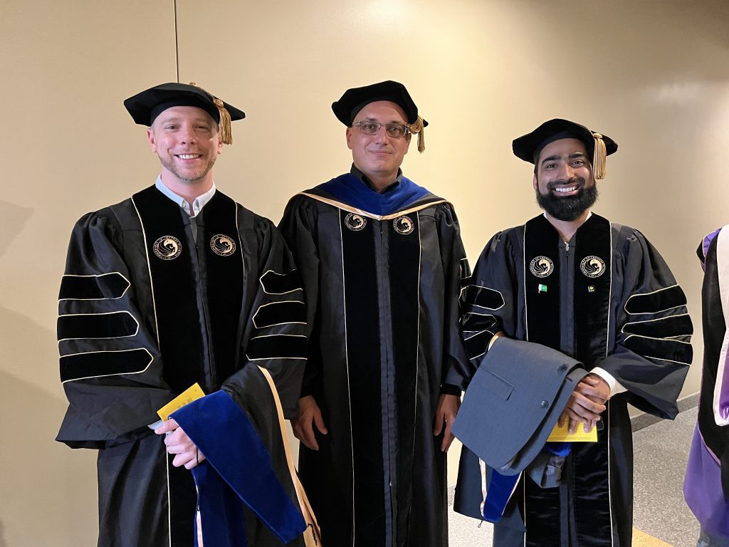 Preparing for the graduation ceremony of Saad Mehmood and Coleman Cariker