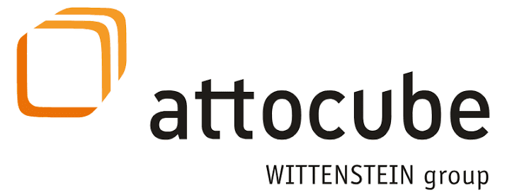Attocube logo with two overlapping orange squares on the left and “WITTENSTEIN group” written below the company name in black text.