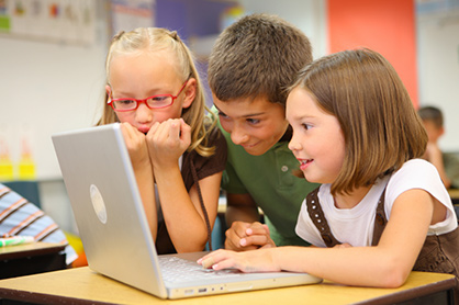 Children looking at a laptop