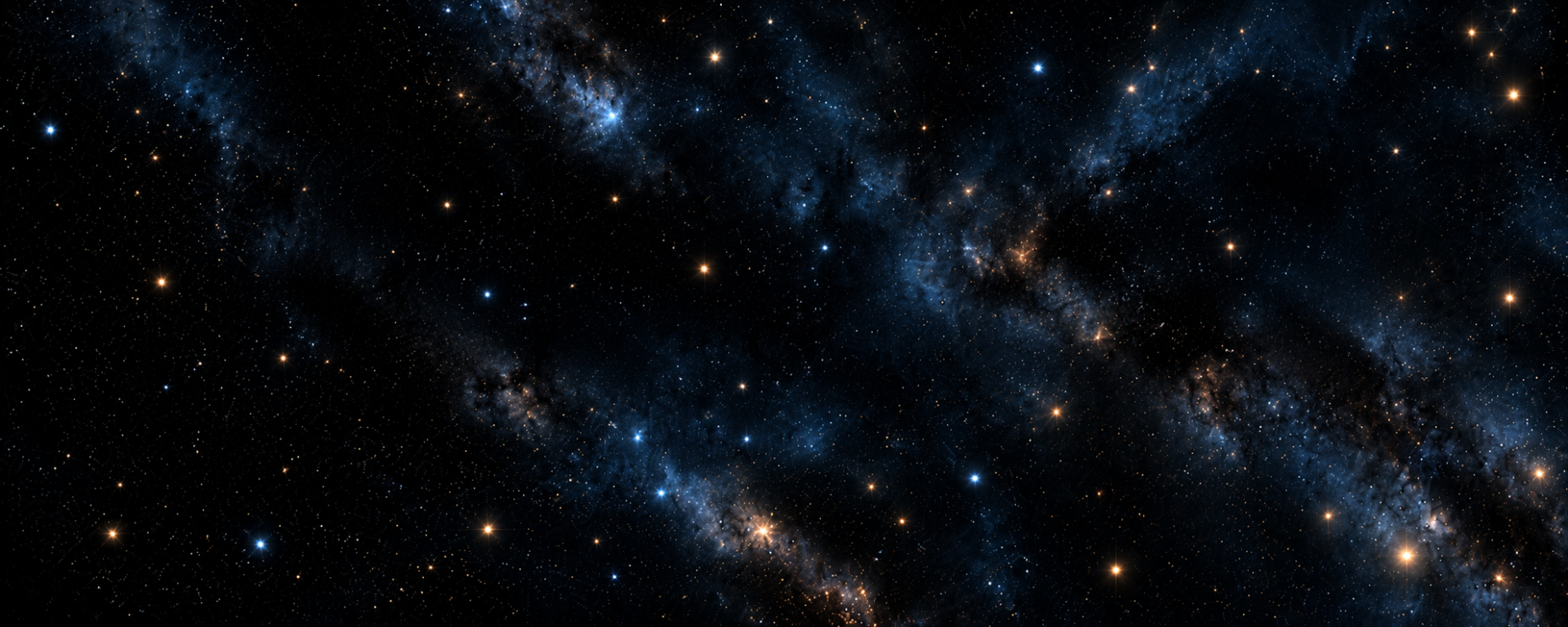 A view of deep space showing numerous stars and blue nebula clouds scattered across a dark background.