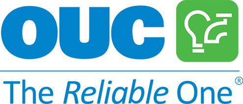 OUC logo with blue letters, a green square featuring a lightbulb design, and the tagline "The Reliable One" below in blue and italicized font.