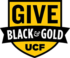 Yellow shield-shaped logo with the words "GIVE BLACK & GOLD UCF" in bold black and white text.